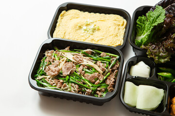 Stir-fried meat and side dishes in packaging containers, Korean food
