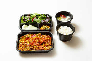Take-out lunch box, spicy stir-fried meat and side dishes	