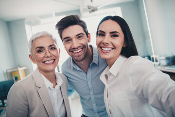 Fototapeta premium Photo of business people woman man making selfie smiling in modern office