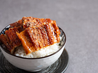 a bowl of boiled eel and rice