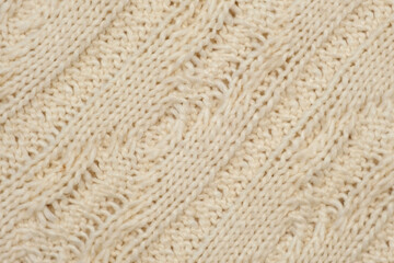Soft Knitted Woolen Detailed Texture. Natural Fabric Closeup Knit Pattern. Beige Knitwear, Warm Cashmere Surface. Rotation, Macro. Cozy Creamy Textile Background. Clothes Production. Melange Yarn.
