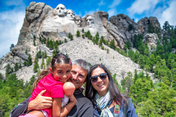 Naklejka premium A happy family of three people visiting Mt Rushmore, South Dakota