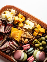 Raw ham, olives and cheese on a plate	