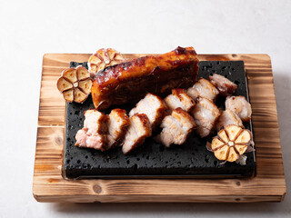 Oven-baked meat on a stone plate	