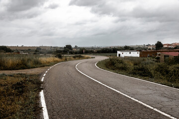 Fototapeta premium a paved road near Grimaldo, municipality of Canaveral, province of Caceres, Extremadura, Spain