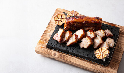 Oven-baked meat on a stone plate