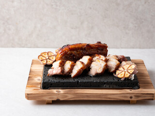 Oven-baked meat on a stone plate