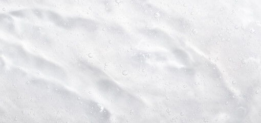 Cosmetic gel, serum transparent sample. Liquid cream with bubble texture. Gel texture of a cosmetic product. Clear liquid lotion for skin care.