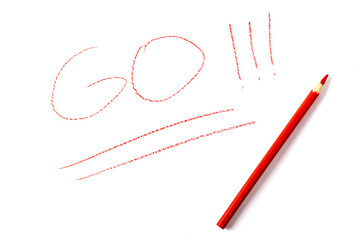 The word GO written in red pencil on a white sheet of paper