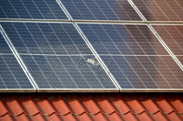 Photo collage of sunset and solar panel, photovoltaic