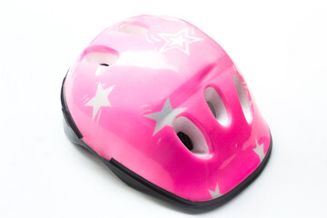 Fototapeta premium pink safety helmet for children, isolated on white background