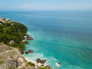 Isolated Bali, Indonesia sea cliff with islands nestled in crystal clear  blue turquoise water