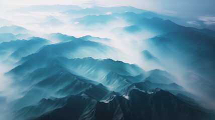 Aerial shot of black mountains in fog top view beautiful background