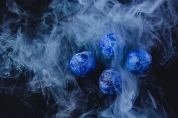 Mystical blue orbs shrouded in swirling smoke