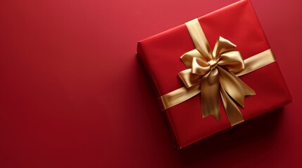 Red gift box with gold ribbon , clean red background