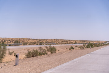 A road with a dirt road next to it