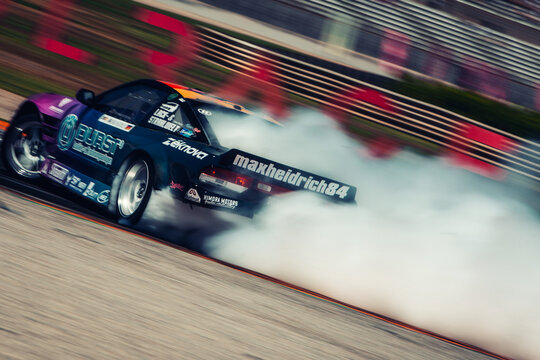 Nissan S14 in drift with a lot of smoke