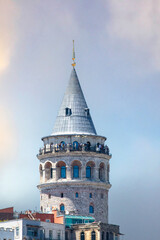 Obraz premium Galata Tower on dramatic sky background. Historical artifacts. 