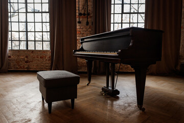 Old vintage grand piano in a room.