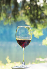 Glass of red wine. A glass of red wine in nature.