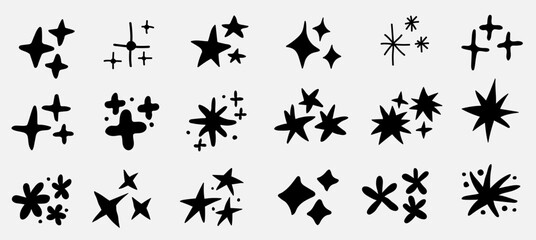 Vector set of doodle stars shape and sparkles. Hand drawn elements isolated on white background.