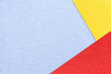 Texture of craft light blue color paper background with yellow and red border. Vintage abstract very peri cardboard.