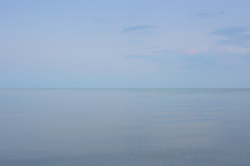 Sky, water and background with ocean in nature for travel destination, peace and calm sea. Coast, clouds and wallpaper of earth at sunset for climate, ecology and outdoor environment in Cancun