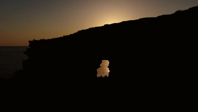 Sunset in Sa Figuera Borda Cave Ibiza with drone
