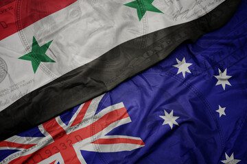 waving colorful flag of syria and national flag of australia on the dollar money background....