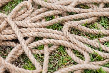 Nautical rope lies on the ground, close up