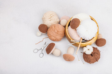 Set of clew of thread for knitting. Crocheted mushrooms, handmade, hobby concept. Props
