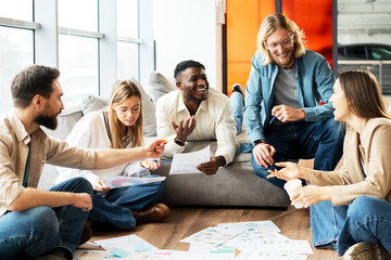 Diverse team of young professionals is brainstorming new project together