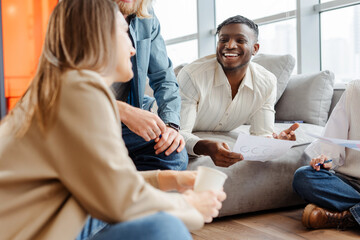 Diverse team of professionals having a productive meeting in a modern office