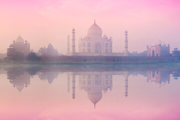 Naklejka premium Taj Mahal on sunrise sunset reflection in Yamuna river panorama in fog, Indian Symbol - India travel background. Agra, Uttar Pradesh, India