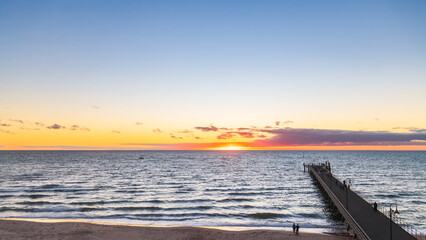 Fototapeta premium Beautiful sunset at Glenelg Beach viewed from ferris wheel, South Australia