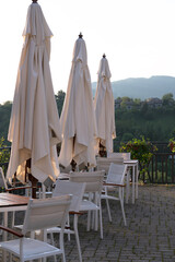 White tables and chairs in a terrace 