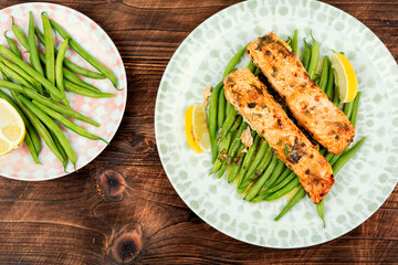 Baked salmon with green fresh vegetable.