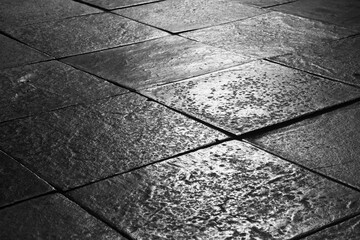 Dark cast iron floor slabs in a medieval Russian church.