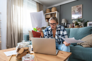 Young introvert freelancer businesswoman with ADHD working remotely from home office on laptop...