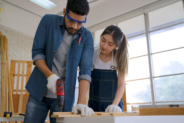 Obraz premium Carpenters are working at woodshop.