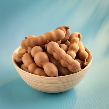 Fresh delicious ripe tamarind on blue background 