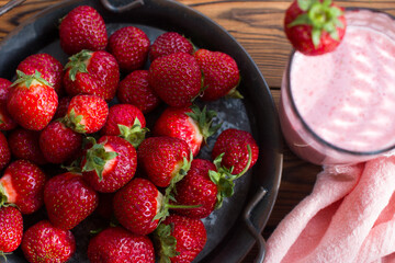 red strawberries on a plate and a healthy strawberry cocktail. Healthy vitamin breakfast