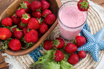 red strawberries on a plate and a healthy strawberry cocktail. Healthy vitamin breakfast