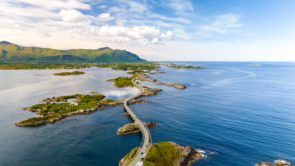 A picturesque aerial view of the Atlantic Road in Norway, showcasing a winding bridge connecting...