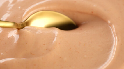 Mixing with spoon Pink sauce mayonnaise and ketchup