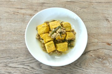 deep fried yellow tofu with mashed pork with celery on plate 