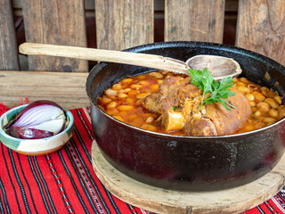 romanian traditional food, beans with boiled pork chop
