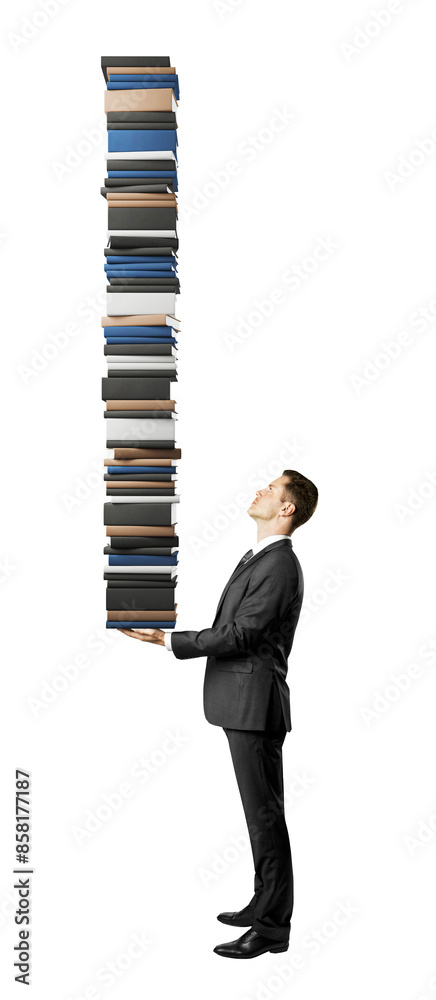 Aufkleber Man in a suit holding a tall stack of books isolated on a white background representing a concept of knowledge or workload