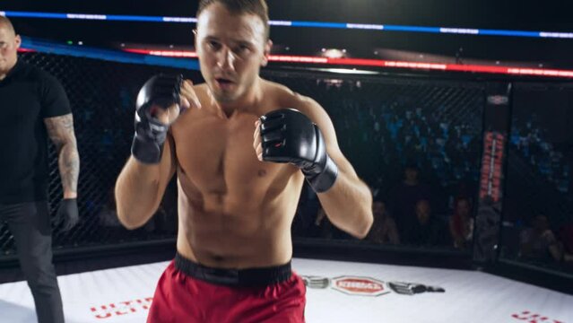 POV Experience of a MMA Fight Through the Fighter&rsquo;s Eyes as His Opponent Tries to Land Hits. Footage is Full of Rapid Movements, Each Successful Strike Making the Screen Shudder With the Force