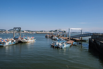 Fototapeta premium Scenery of a fishing village with small fishing boats 